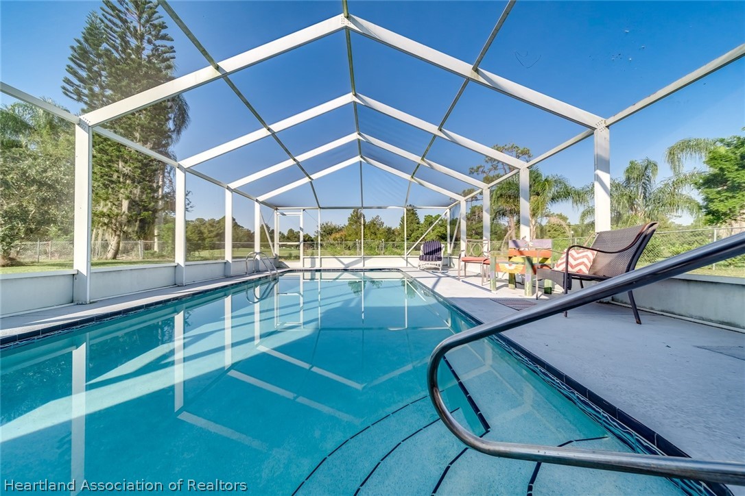 3264 Golfview Road Sebring, FL 33875 - Photo 19 of 27 a view of a swimming pool with a patio