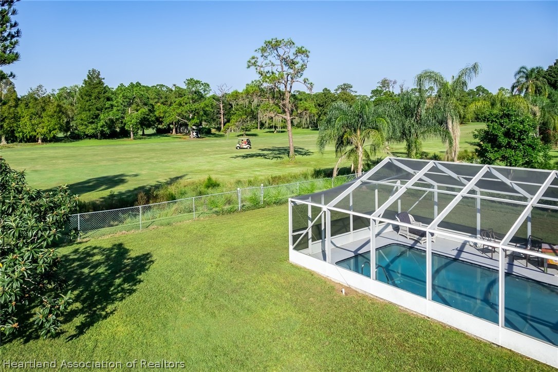 3264 Golfview Road Sebring, FL 33875 - Photo 21 of 27 a view of a swimming pool with a yard