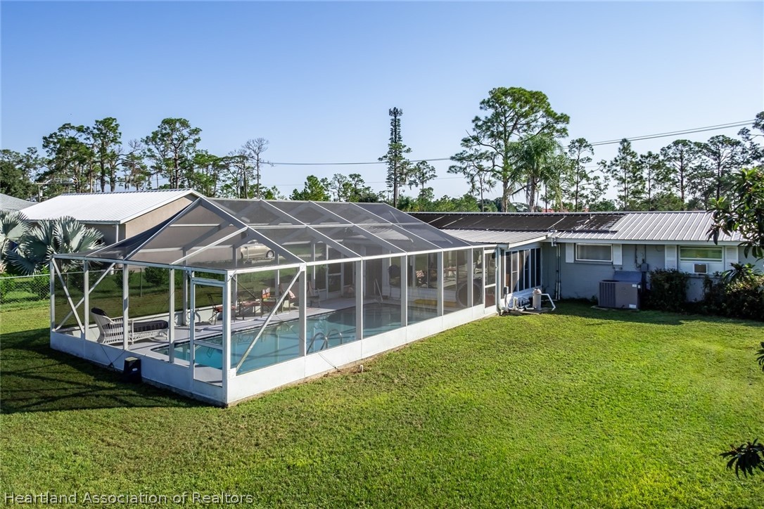 3264 Golfview Road Sebring, FL 33875 - Photo 23 of 27 a view of a house with a yard and sitting area