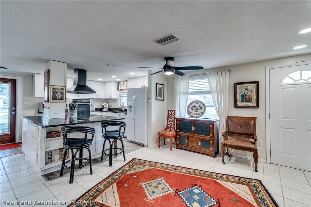 3264 Golfview Road Sebring, FL 33875 - Photo 6 of 27 a living room with furniture and wooden floor