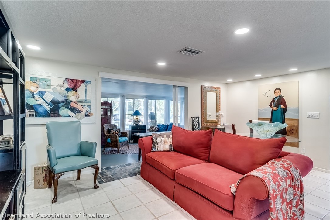 3264 Golfview Road Sebring, FL 33875 - Photo 7 of 27 a living room with furniture and a flat screen tv
