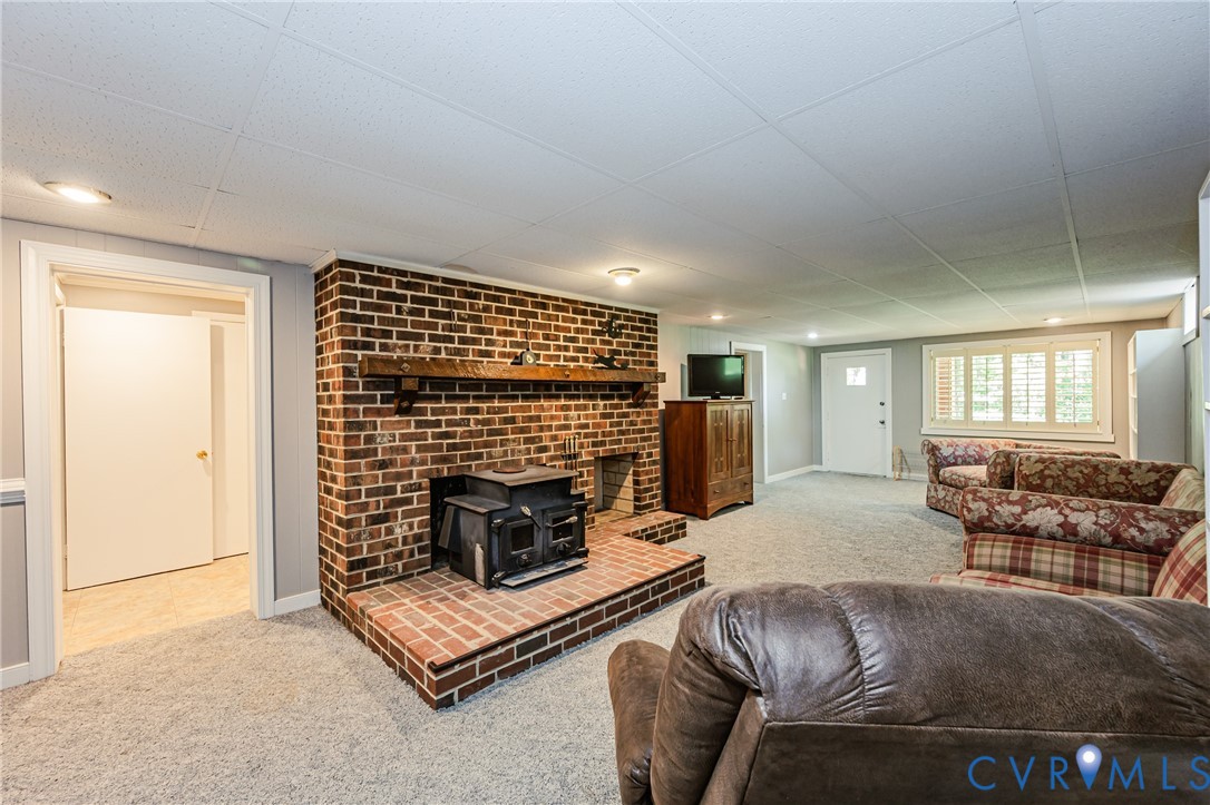 15611 Robert Terrell Road Montpelier, VA 23192 - Photo 7 of 28 Spacious room featuring a brick fireplace with a w