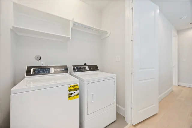 a utility room with dryer and washer