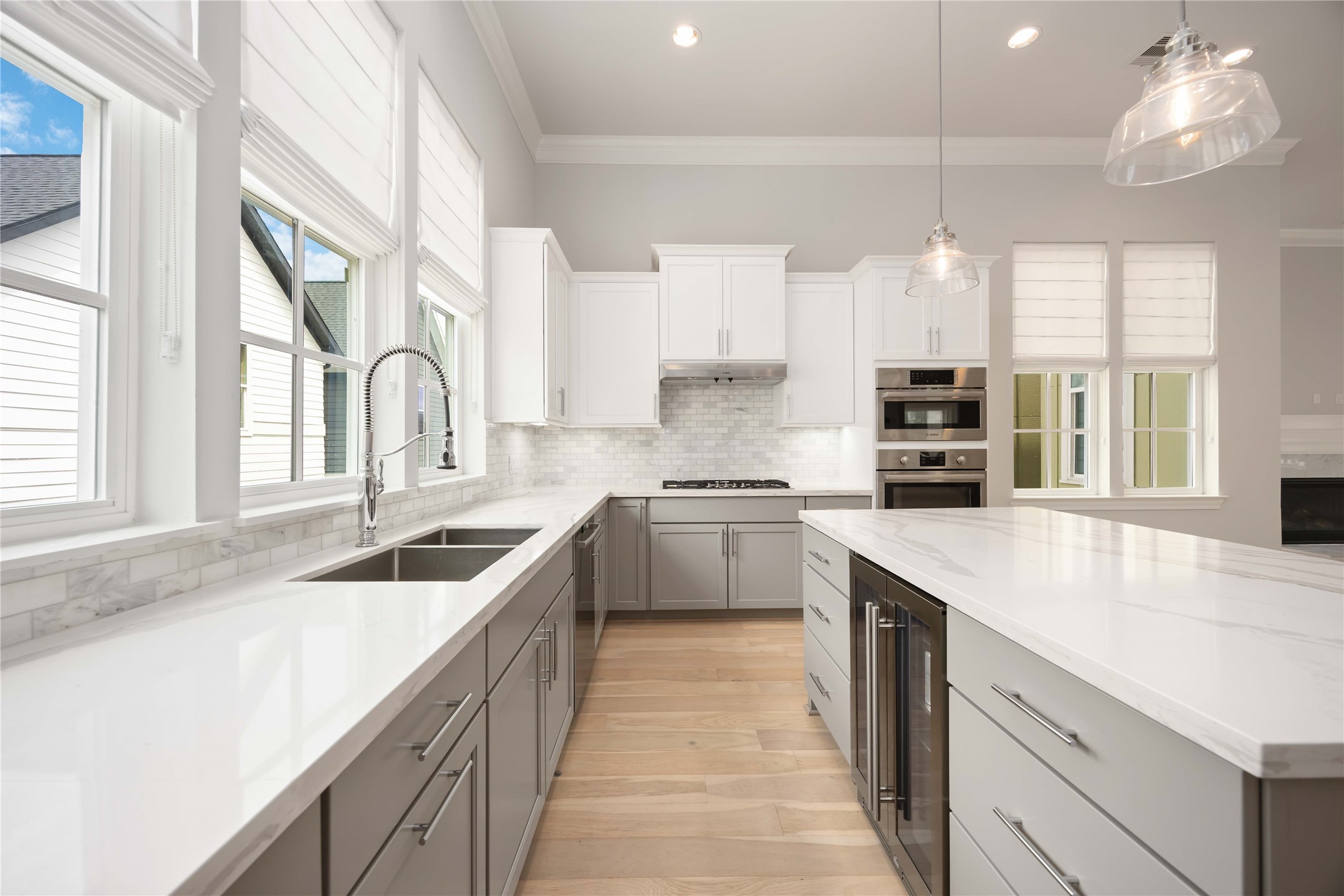 610 Delmar Street Houston, TX 77023 - Photo 4 of 27 a kitchen with white cabinets appliances a sink and a window