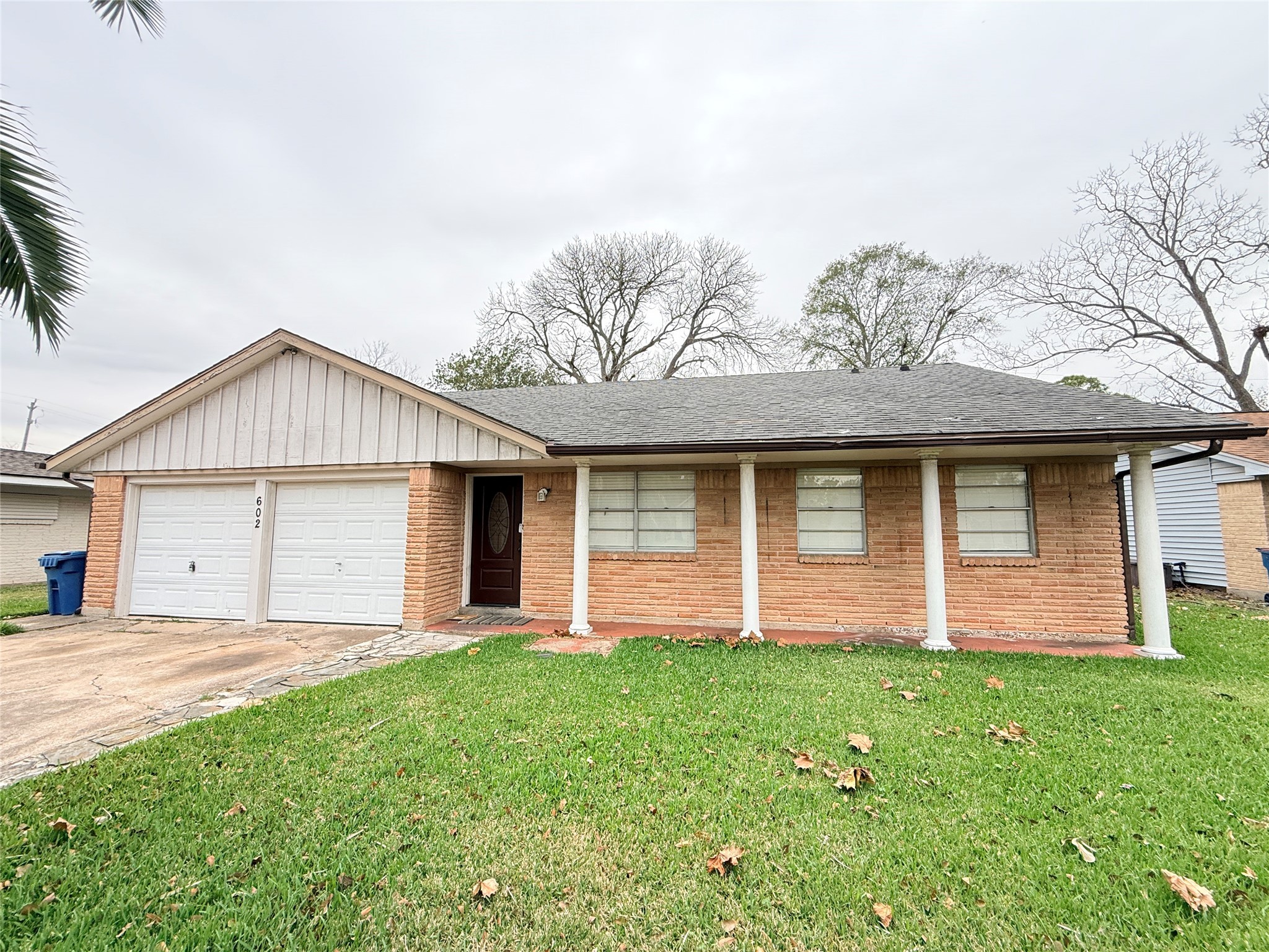 602 Cole Street Webster, TX 77598 - Photo 1 of 18 a front view of house with yard and green space
