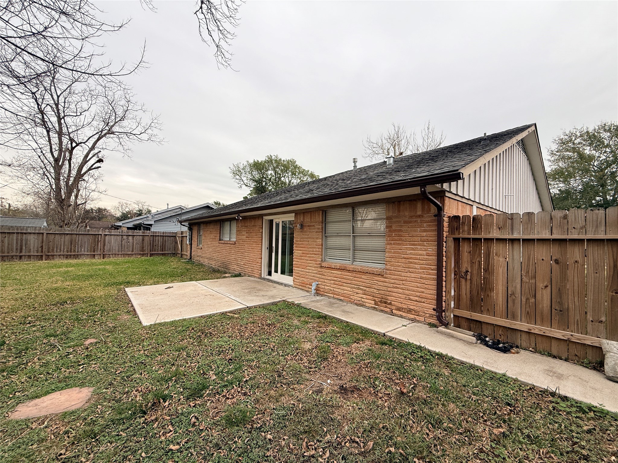 602 Cole Street Webster, TX 77598 - Photo 17 of 18 a backyard of a house with wooden fence