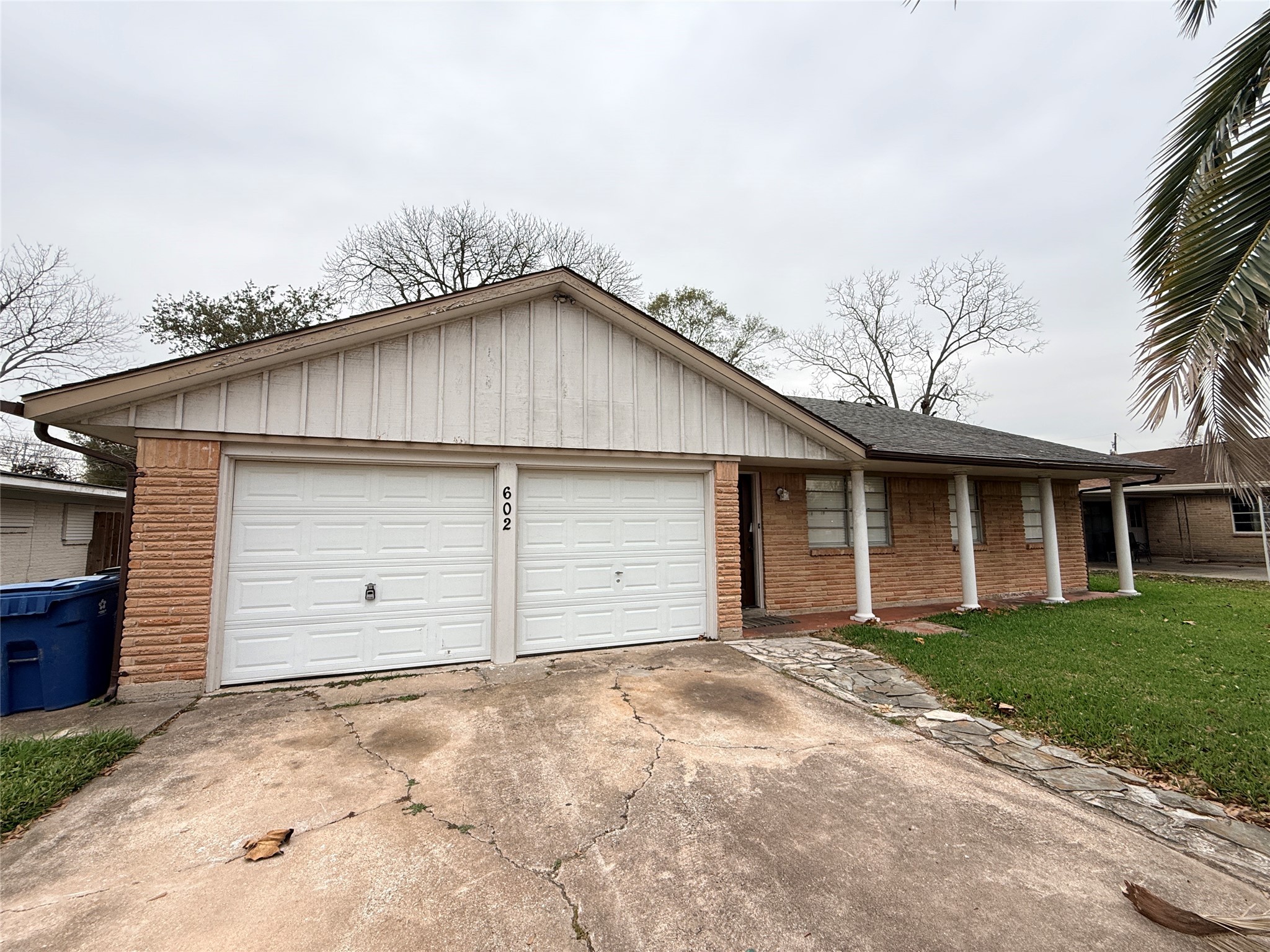 602 Cole Street Webster, TX 77598 - Photo 2 of 18 a view of a house with a yard and garage