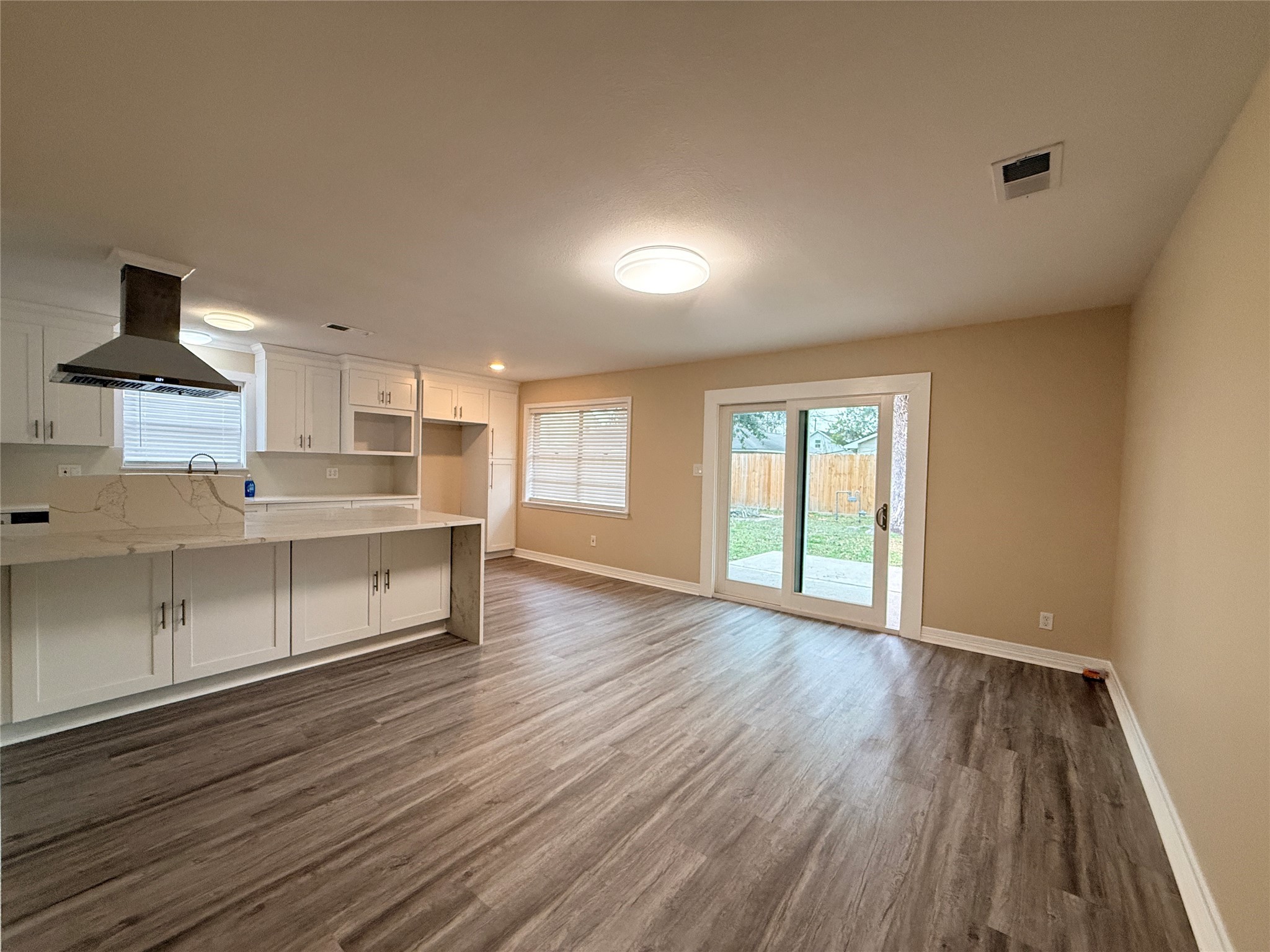 602 Cole Street Webster, TX 77598 - Photo 5 of 18 a view of a kitchen with wooden floor and a sink