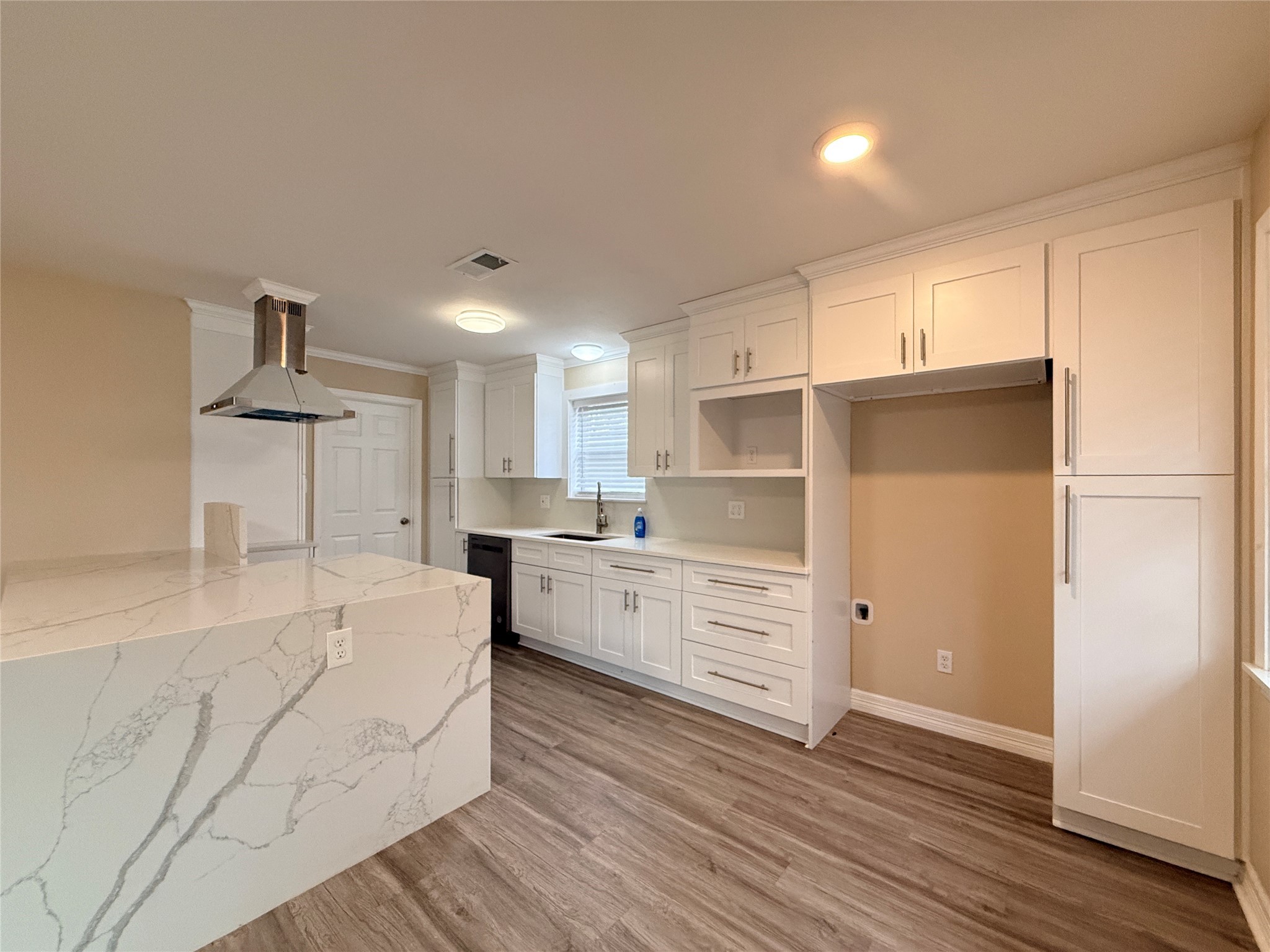 602 Cole Street Webster, TX 77598 - Photo 8 of 18 a large white kitchen with kitchen island a sink a stove and a refrigerator