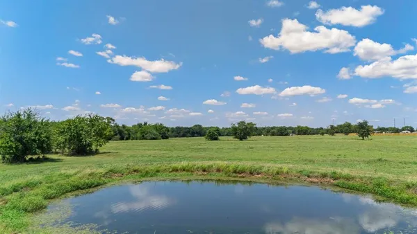 a view of a golf course with a lake