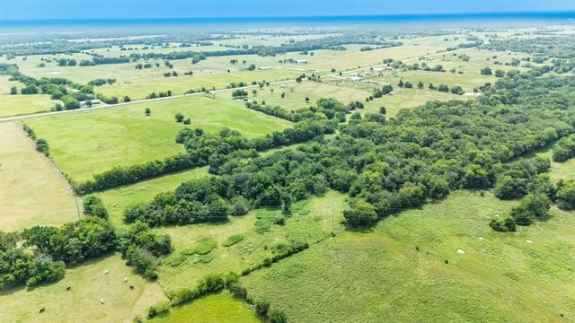 a view of a lake with a yard