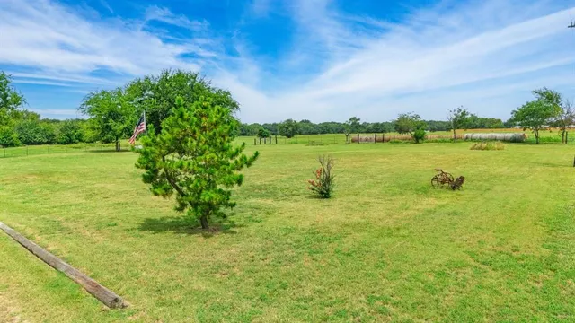 a view of a lake with houses in the back
