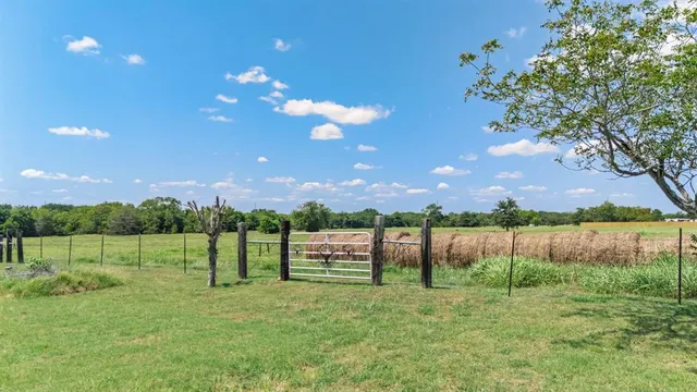 a view of a garden with sitting area