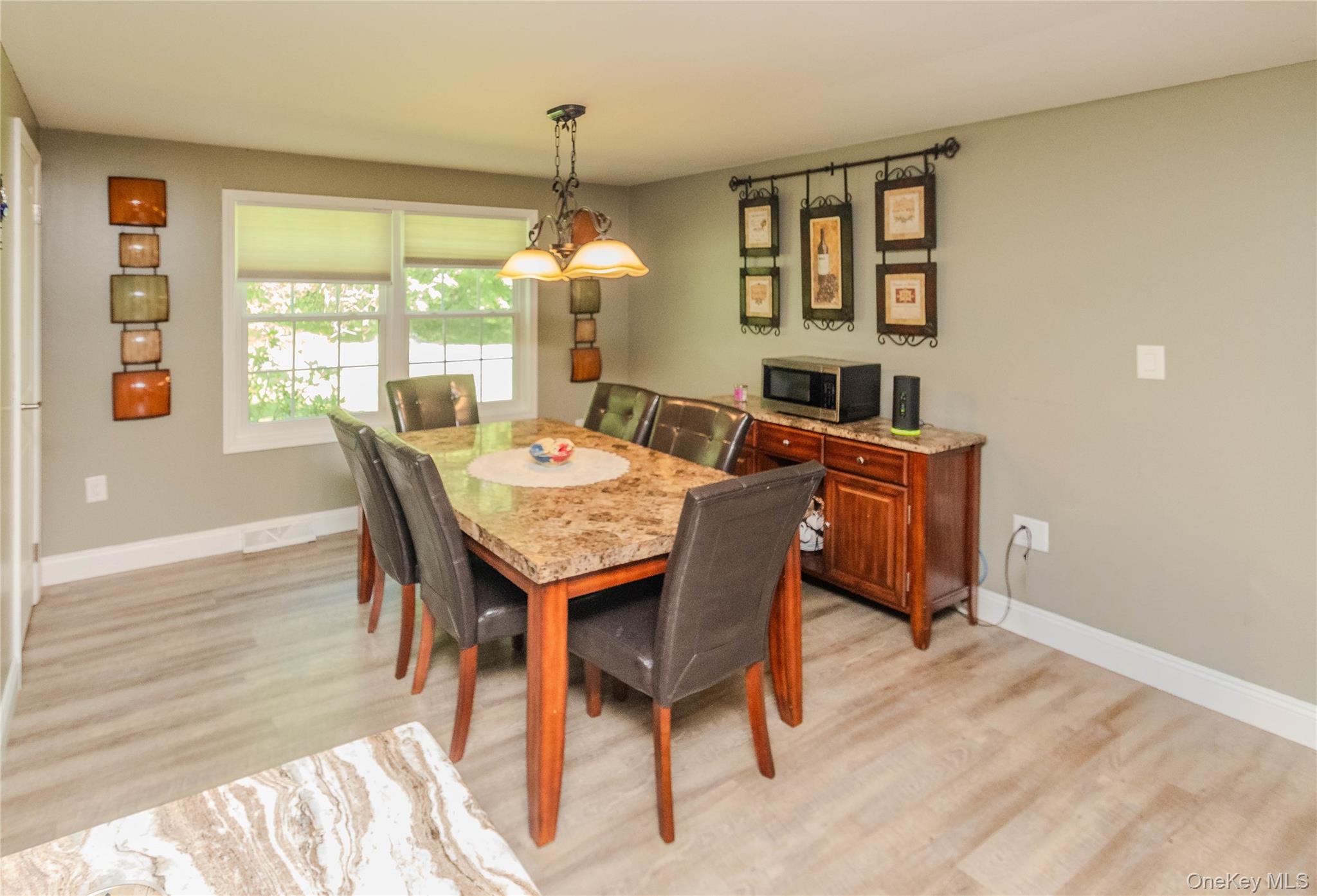 15 Van Dewark Road Middletown, NY 10941 - Photo 14 of 41 Dining area featuring light wood-finish flooring, neutral wall tones, and white trim