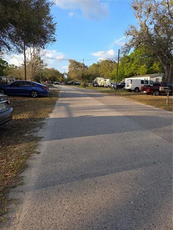 a view of street with parked cars