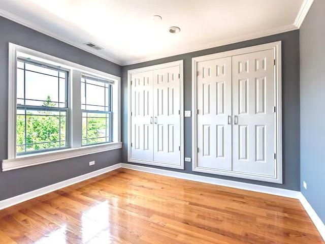 a view of an empty room with a window