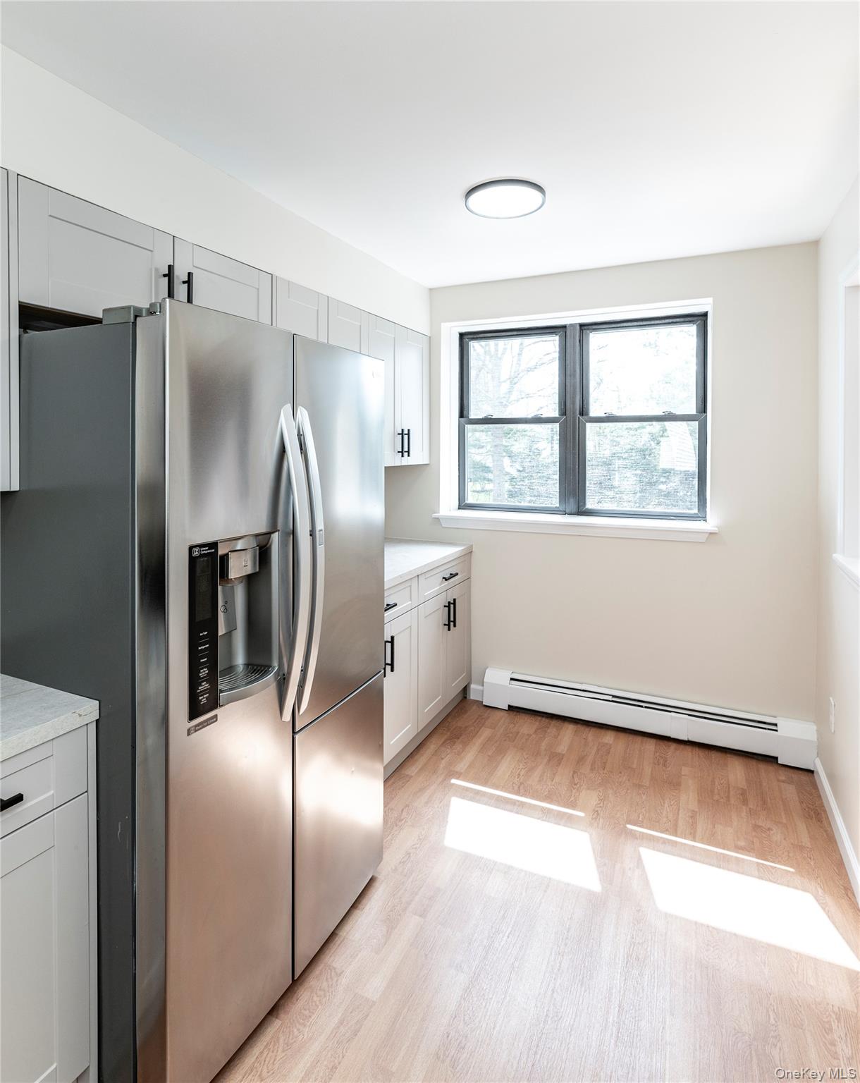 126 North Rte 303, Unit 2 Congers, NY 10920 - Photo 5 of 21 a view of a refrigerator in kitchen and a window