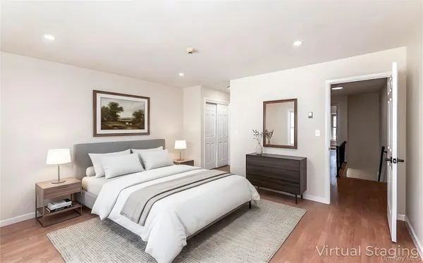 a bedroom with a bed and a lamp