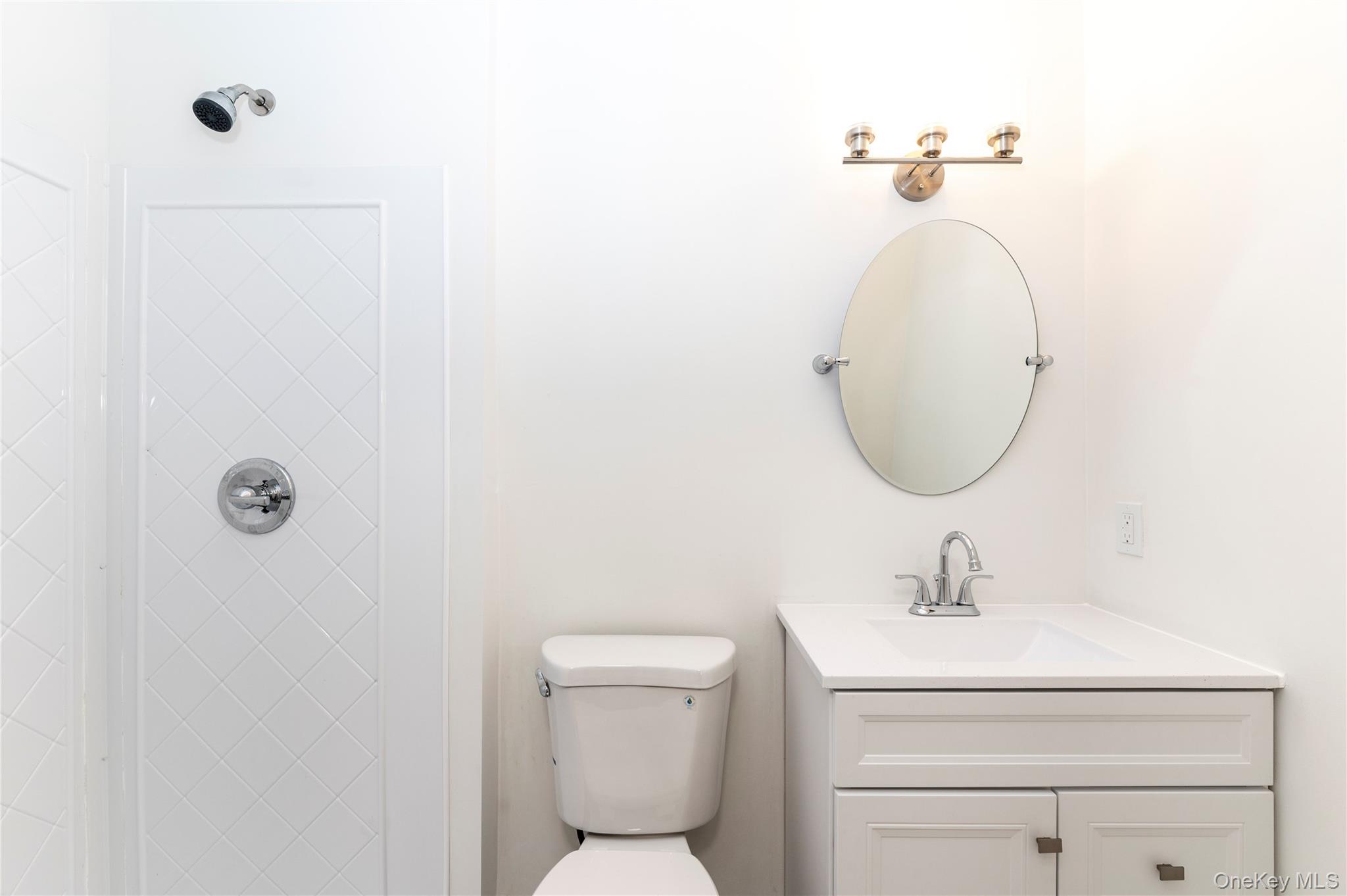 126 North Rte 303, Unit 2 Congers, NY 10920 - Photo 10 of 21 a bathroom with a toilet sink and mirror