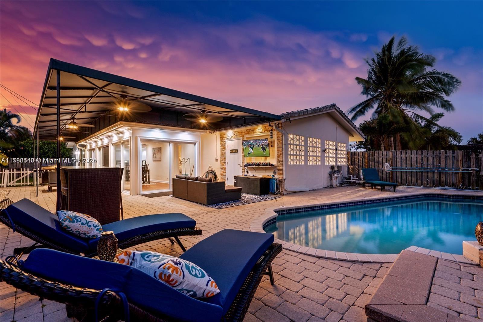 a swimming pool with outdoor seating