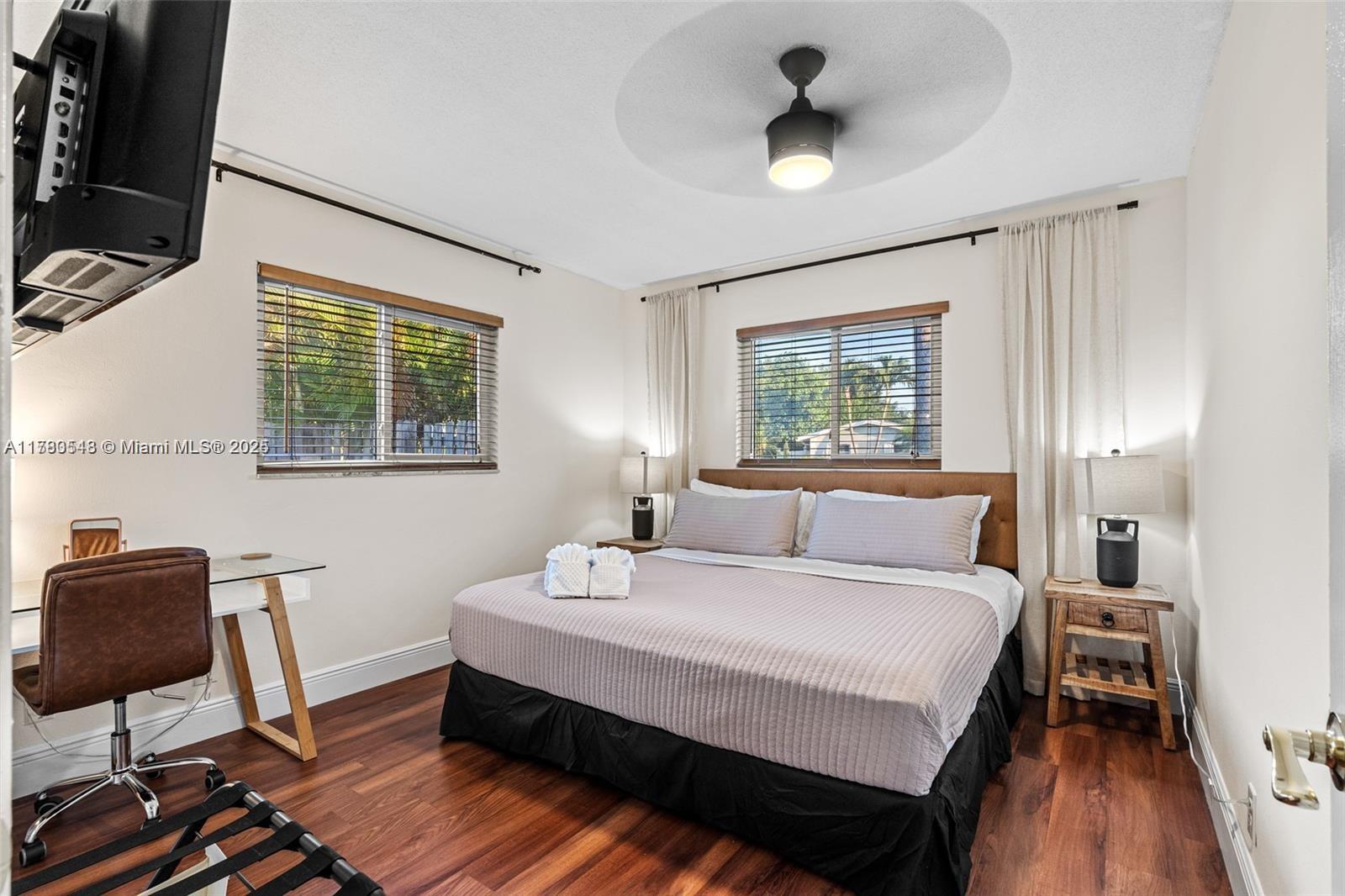 2231 Northeast 38th Street Lighthouse Point, FL 33064 - Photo 11 of 18 a bedroom with a bed and a window