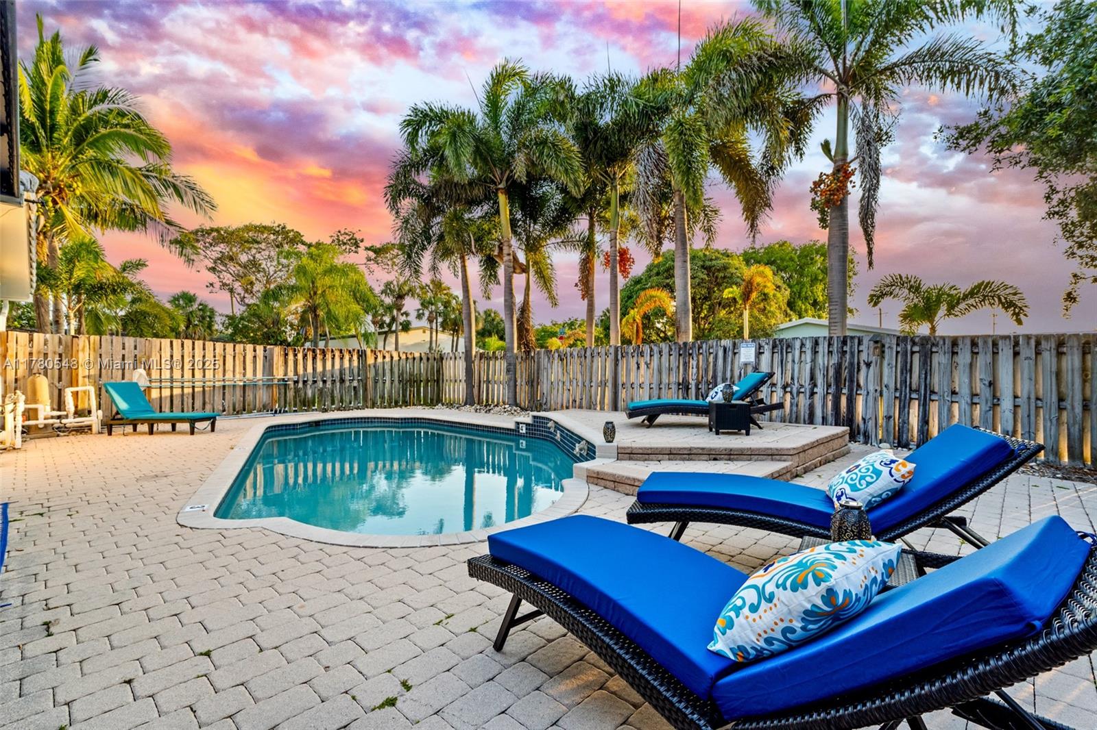 2231 Northeast 38th Street Lighthouse Point, FL 33064 - Photo 17 of 18 a roof deck with table and chairs with wooden floor and fence