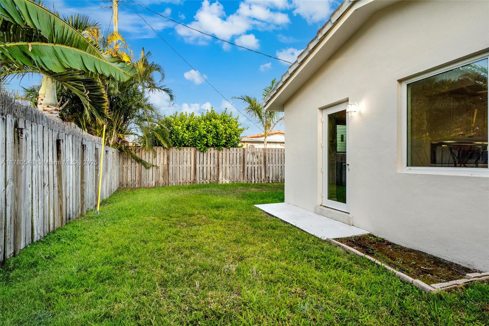 2231 Northeast 38th Street Lighthouse Point, FL 33064 - Photo 18 of 18 a view of a backyard with plants