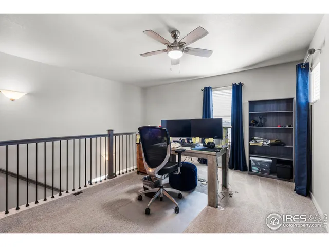 a view of workspace with a window and cabinet