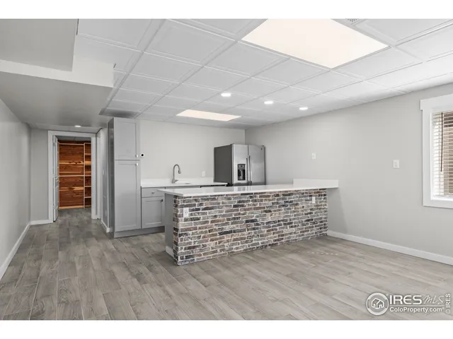 a view of room with wooden floor