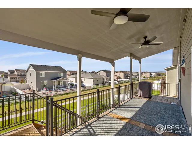 a view of a balcony with furniture