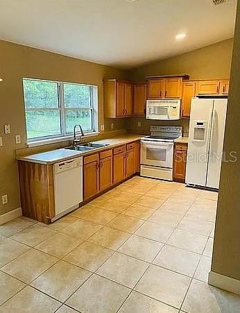 96 Redwood Road Ocala, FL 34472 - Photo 10 of 10 a large kitchen with stainless steel appliances granite countertop a stove a sink dishwasher and a refrigerator