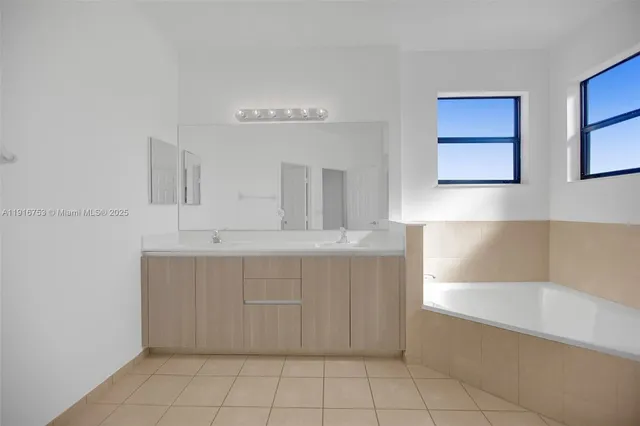 a bathroom with a bathtub and a sink