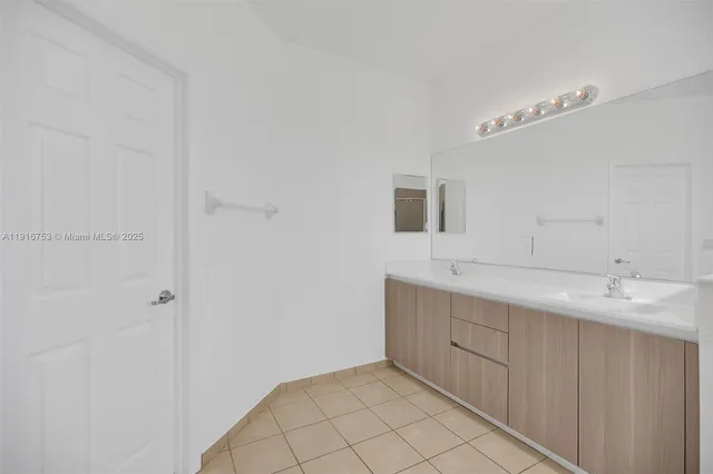 a bathroom with a toilet and bathtub