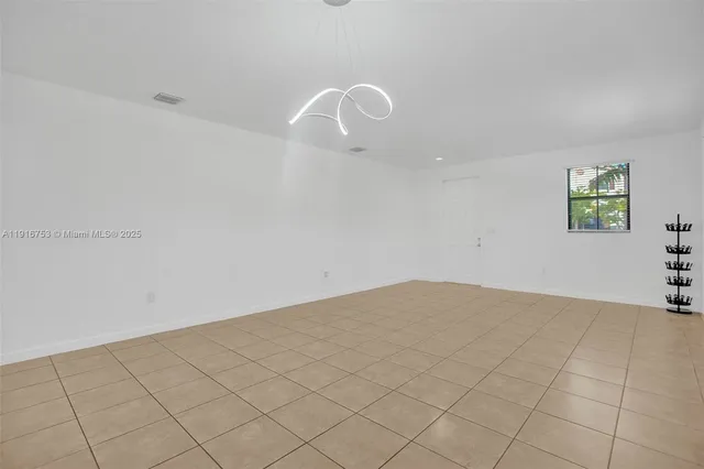 a view of an empty room and window