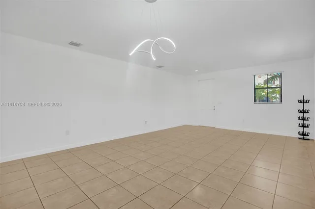 a view of an empty room and window