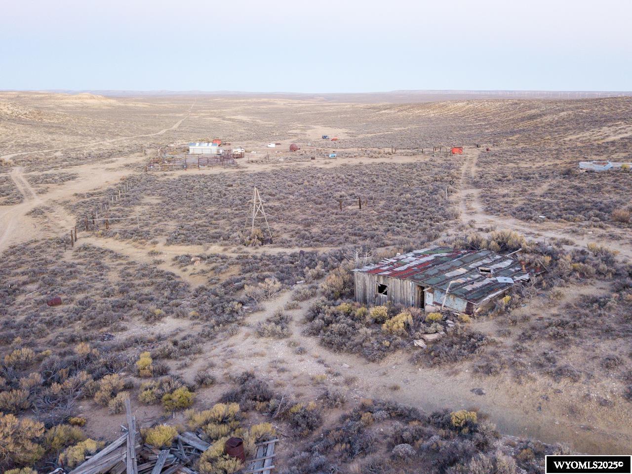 14 14 Mile Road Rock Springs, WY 82901 - Photo 11 of 33 North boundary looking east over old homestead, old well head, and improvements
