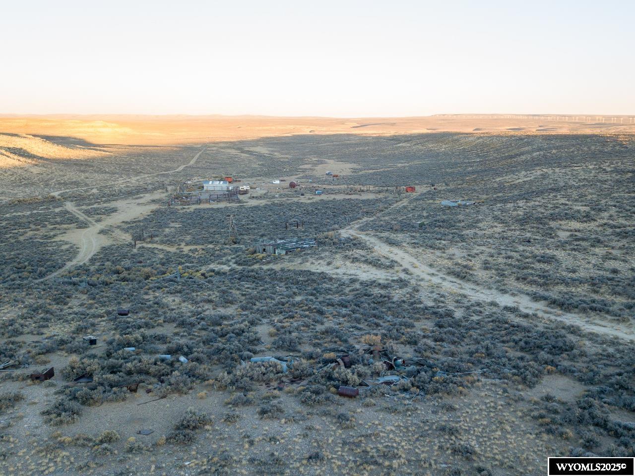 14 14 Mile Road Rock Springs, WY 82901 - Photo 8 of 33 North boundary fence looking east at corrals and improvements