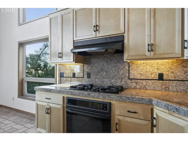 a dining table with a large window