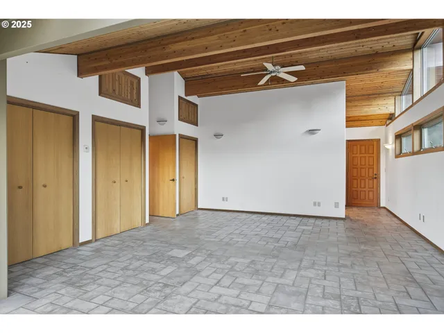 a bathroom with a double vanity sink toilet and shower