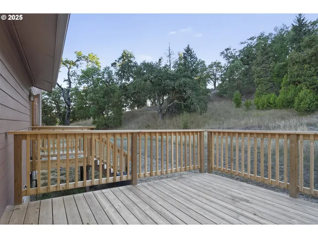 a view of balcony with wooden floor