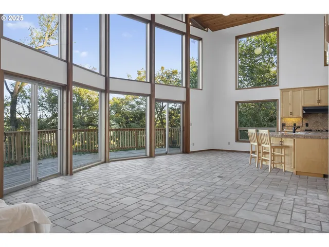 a kitchen with stainless steel appliances kitchen island granite countertop a refrigerator and a stove top oven