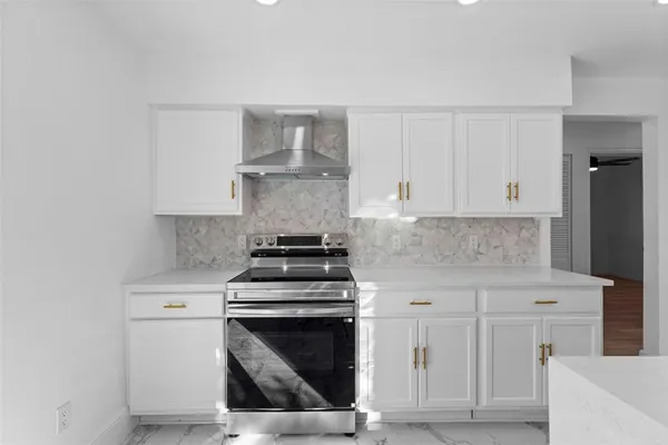 a stove top oven sitting inside of a kitchen