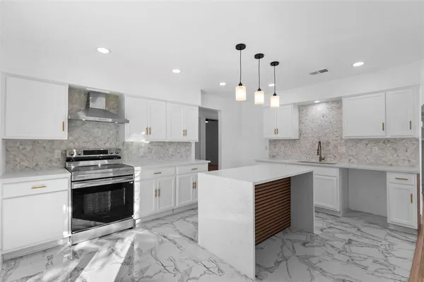 a large kitchen with cabinets a sink and white stainless steel appliances