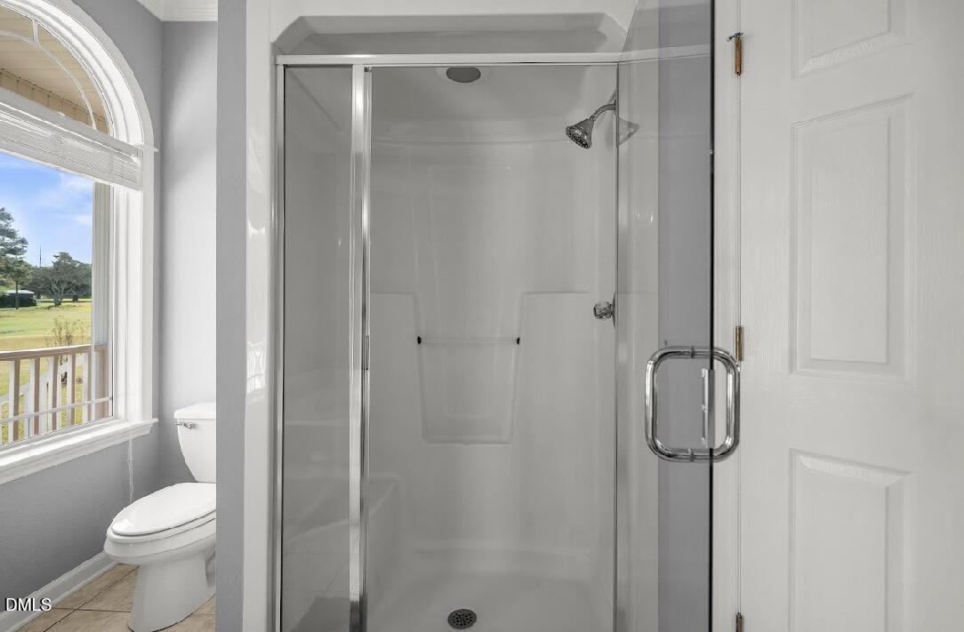 5780 McArthur Road Broadway, NC 27505 - Photo 26 of 40 a bathroom with a shower toilet and sink