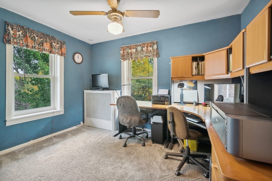 606 Barton Avenue Evanston, IL 60202 - Photo 14 of 27 a view of a workspace with furniture and a window