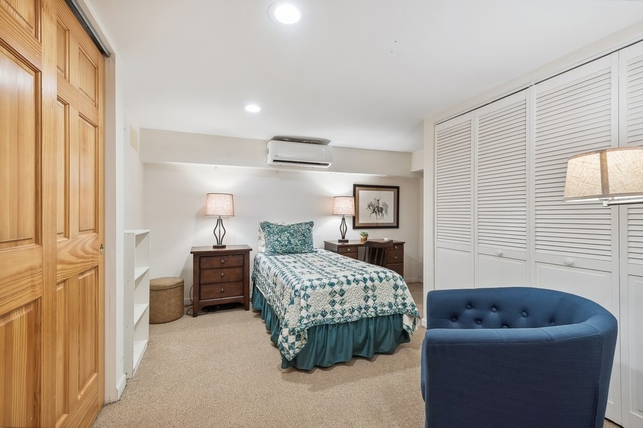 606 Barton Avenue Evanston, IL 60202 - Photo 15 of 27 a bedroom with furniture and a window