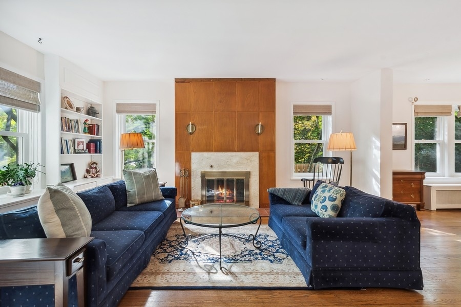 606 Barton Avenue Evanston, IL 60202 - Photo 5 of 27 a living room with furniture and a fireplace