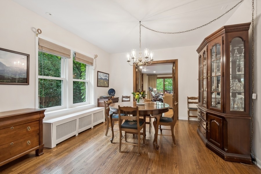 606 Barton Avenue Evanston, IL 60202 - Photo 6 of 27 a view of a dining room with furniture window and wooden floor