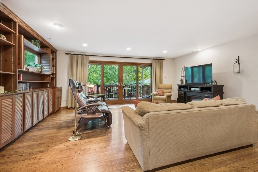 606 Barton Avenue Evanston, IL 60202 - Photo 9 of 27 a living room with furniture tv and a large window