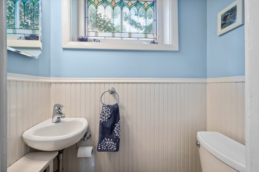 606 Barton Avenue Evanston, IL 60202 - Photo 10 of 27 a bathroom with a sink and a toilet